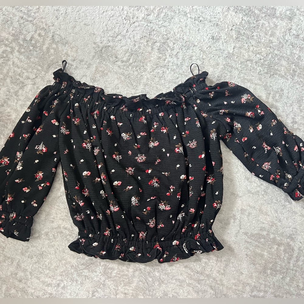 Express floral off the shoulder top.